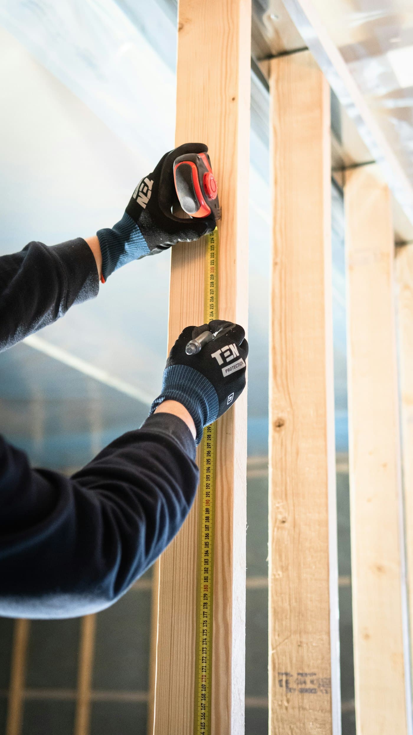 Measuring framing lumber with a tape measure