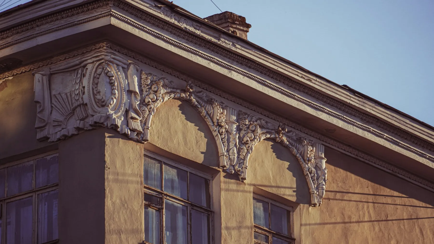 Restored stucco elevation with detailed cornice work